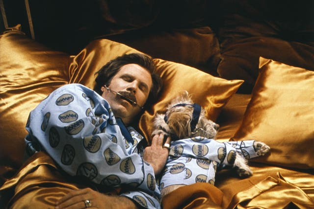 <p>Ron Burgundy (Will Ferrell) and his sidekick Baxter (Peanut) wearig matching pyjamas in ‘Anchorman: The Legend of Ron Burgundy’ in 2004</p>