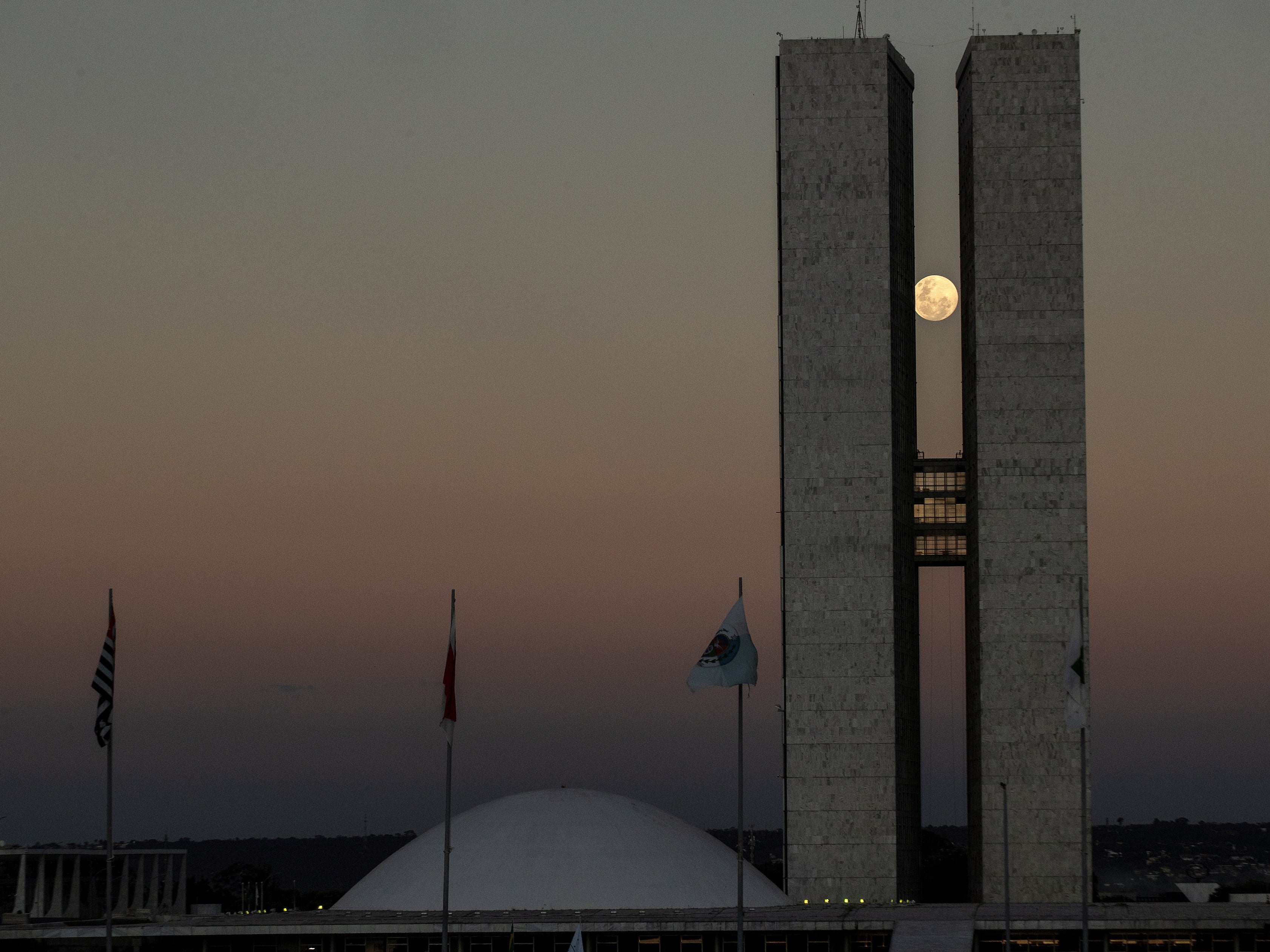 The full moon between the two towers of the National Congress building in Brasilia, Brazil, on Tuesday 25 May 2021