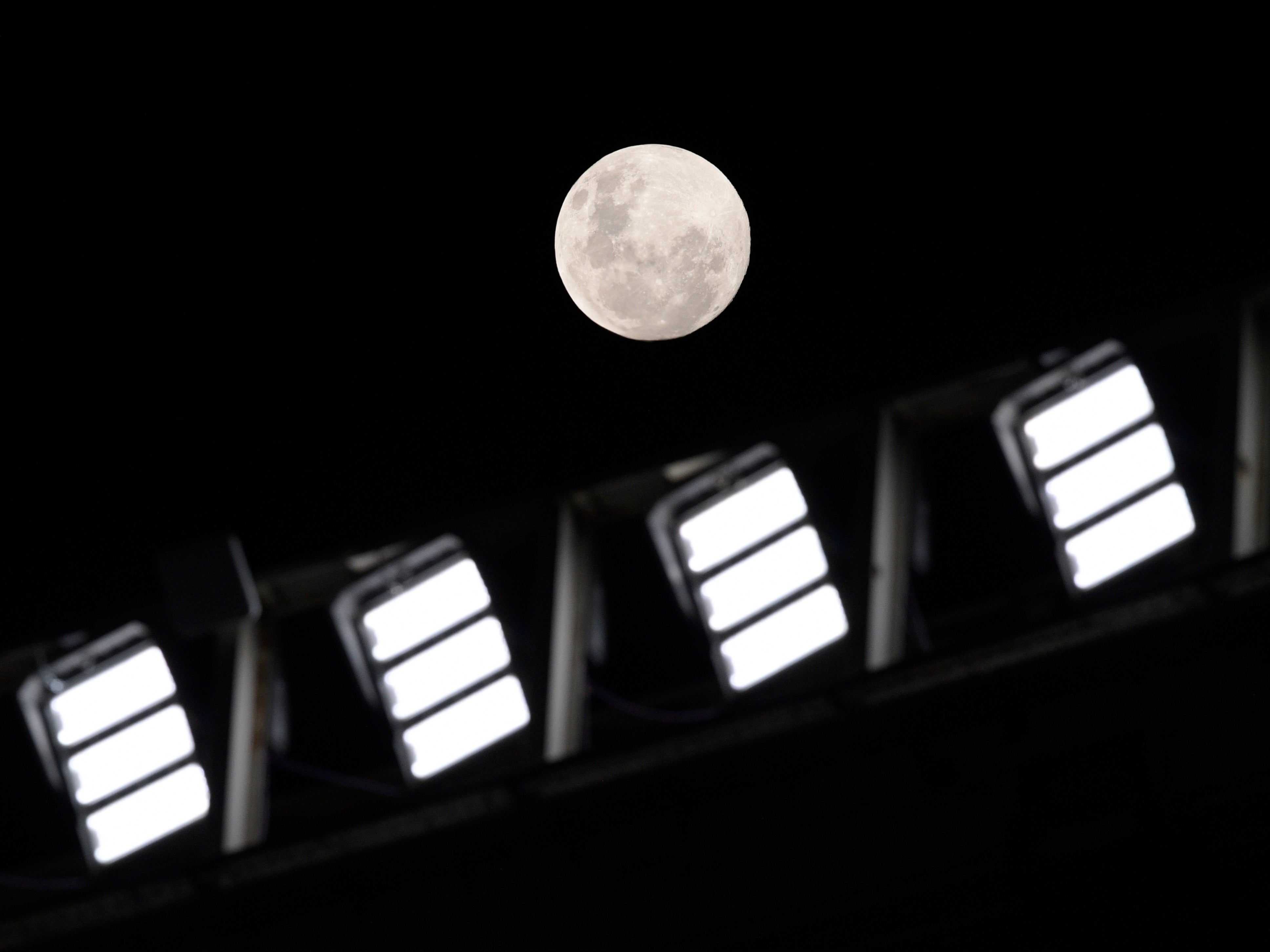 The moon soars over the Estadio Monumental in Buenos Aires, Argentina, as the Copa Libertadores match between River Plate and Fluminense gets underway