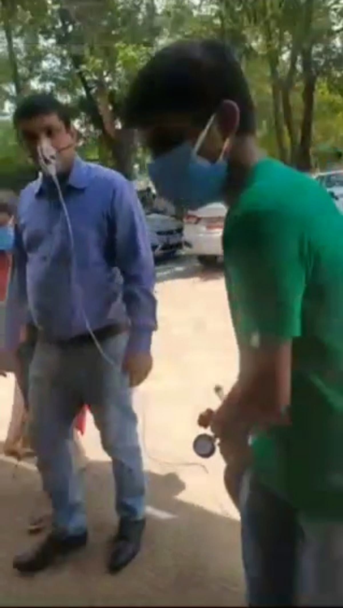 Denied leave while recovering from Covid, Indian bank employee walks to work hooked up to oxygen tank