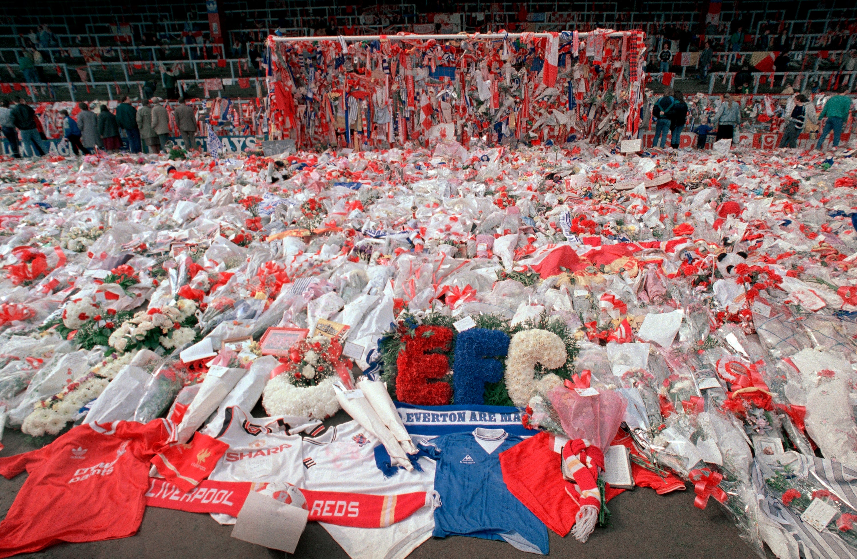Flower tributes cover the ‘Kop’ at Anfield in Liverpool, on 17 April 1989