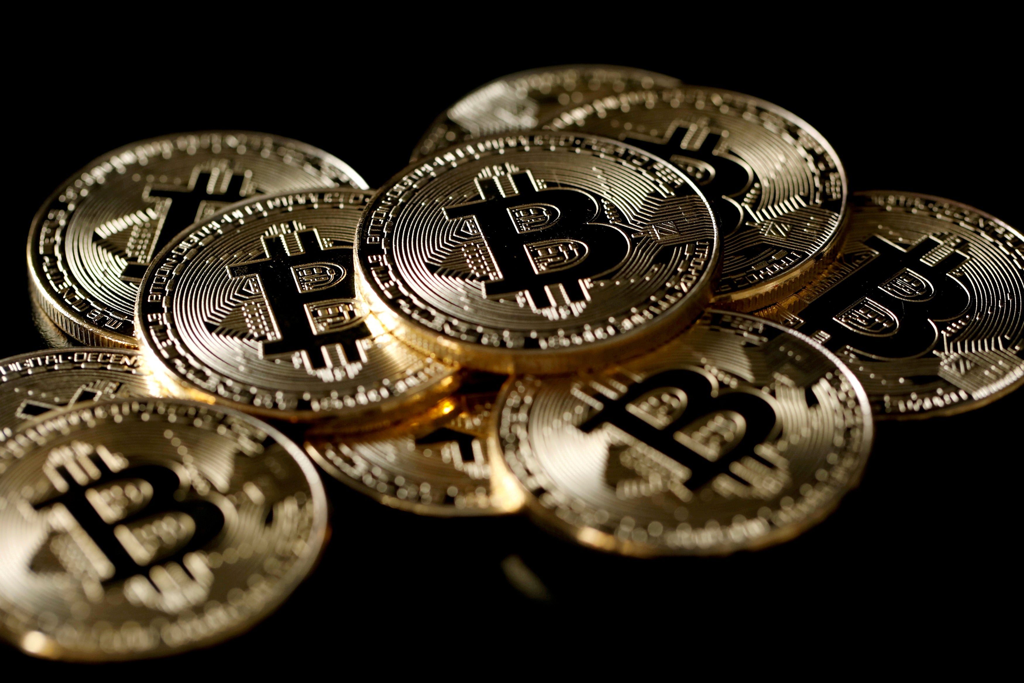 White House reviews 'gaps' in cryptocurrency rules as bitcoin swings wildly