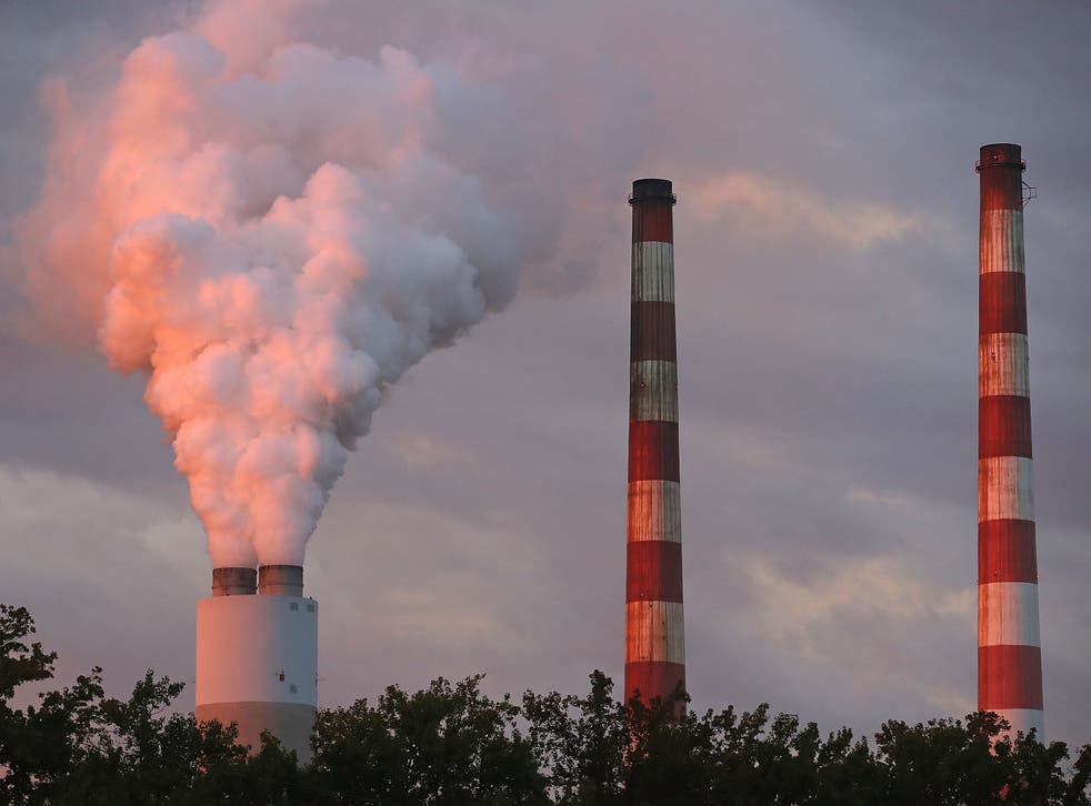 <p>Emissions spew out of a large stack at the coal-fired Morgantown Generating Station on October 10, 2017 in Newburg, Maryland.</p>