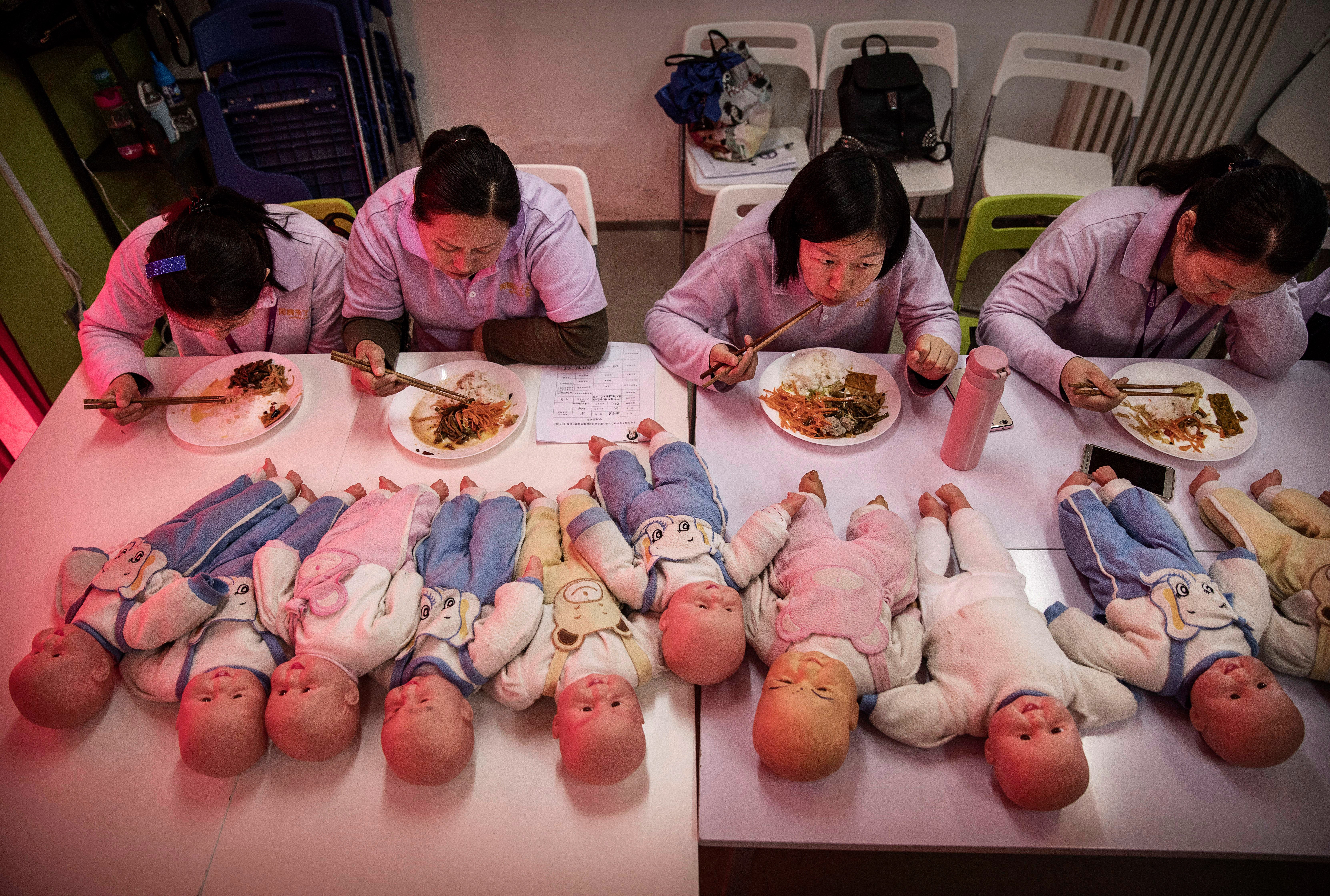 Women in China training to be nannies in Beijing in 2016