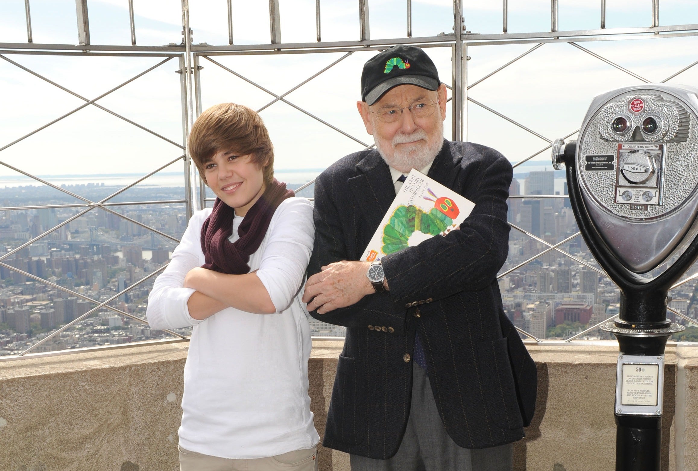 Singer Justin Bieber and author Eric Carle attend the lighting of the Empire State Building to kickoff Jumpstart's Read For The Record Campaign on October 8, 2009 in New York City