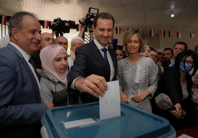 <p>Bashar Assad votes in Douma, Syria with his wife Asma </p>