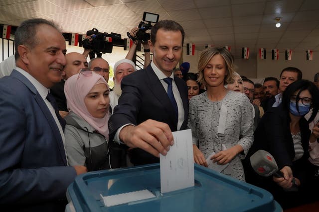 <p>Bashar Assad votes in Douma, Syria with his wife Asma </p>