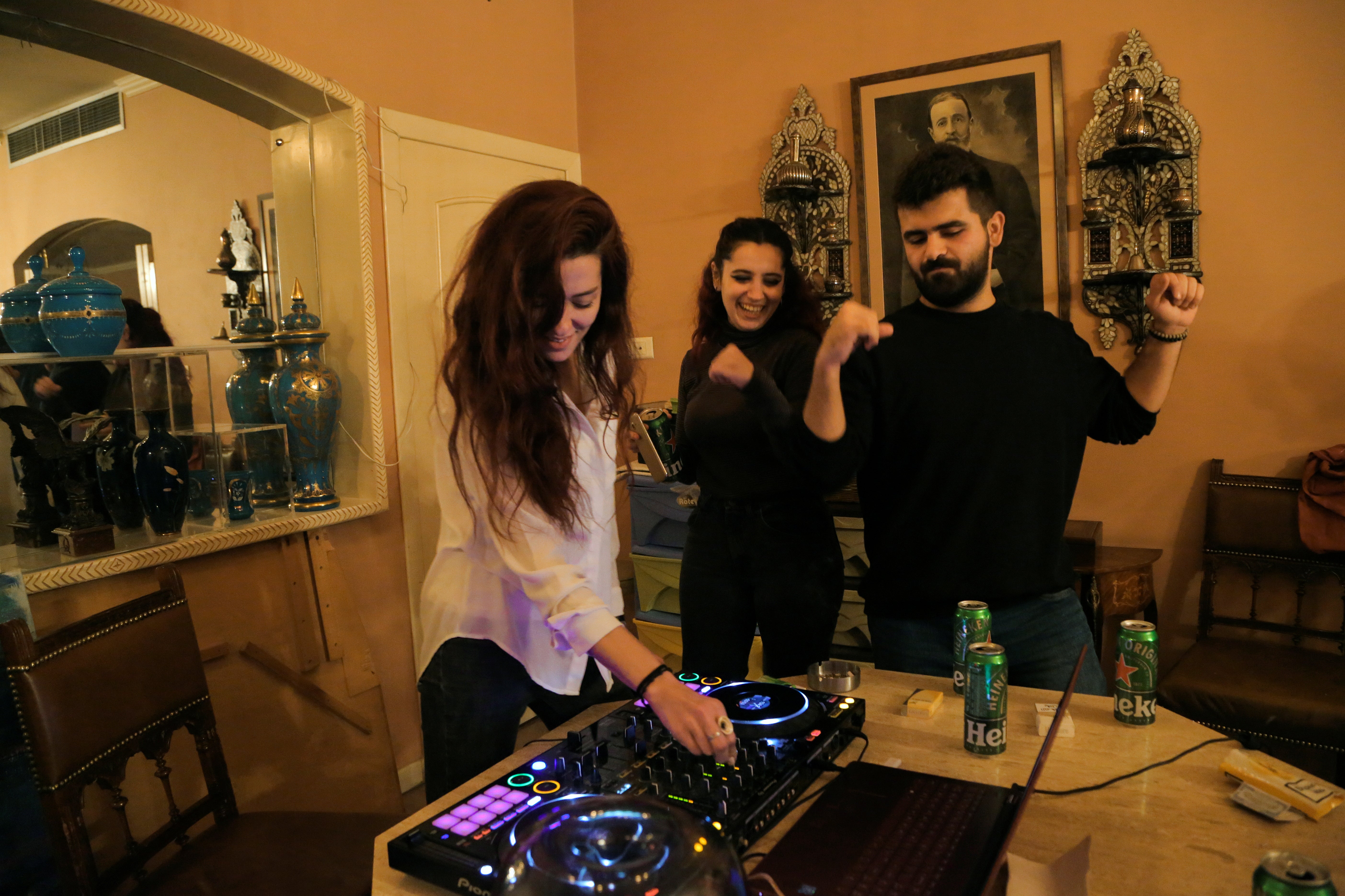 Yara plays techno music at an after party at her friend's house in Damascus