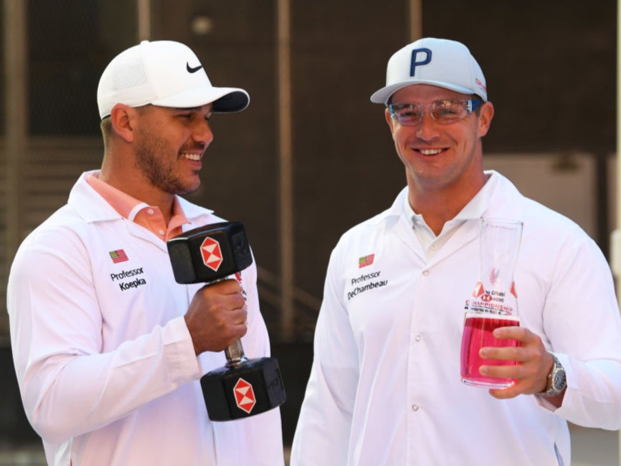 Brooks Koepka and Bryson DeChambeau pose at the Abu Dhabi HSBC Championship