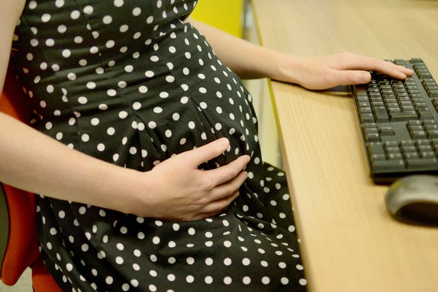 A pregnant office worker