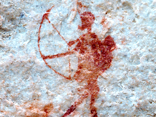 <p>Humans have used bows and arrows for hunting for around 70,000 years – and the new research into the Jebel Sahaba skeletons proves that such weapons were being used in intercommunal warfare between hunter-gatherer groups probably from at least around 20,000 years ago.  This image shows a prehistoric rock painting depicting a southern African San archer in Cederberg Mountains, South Africa.</p>