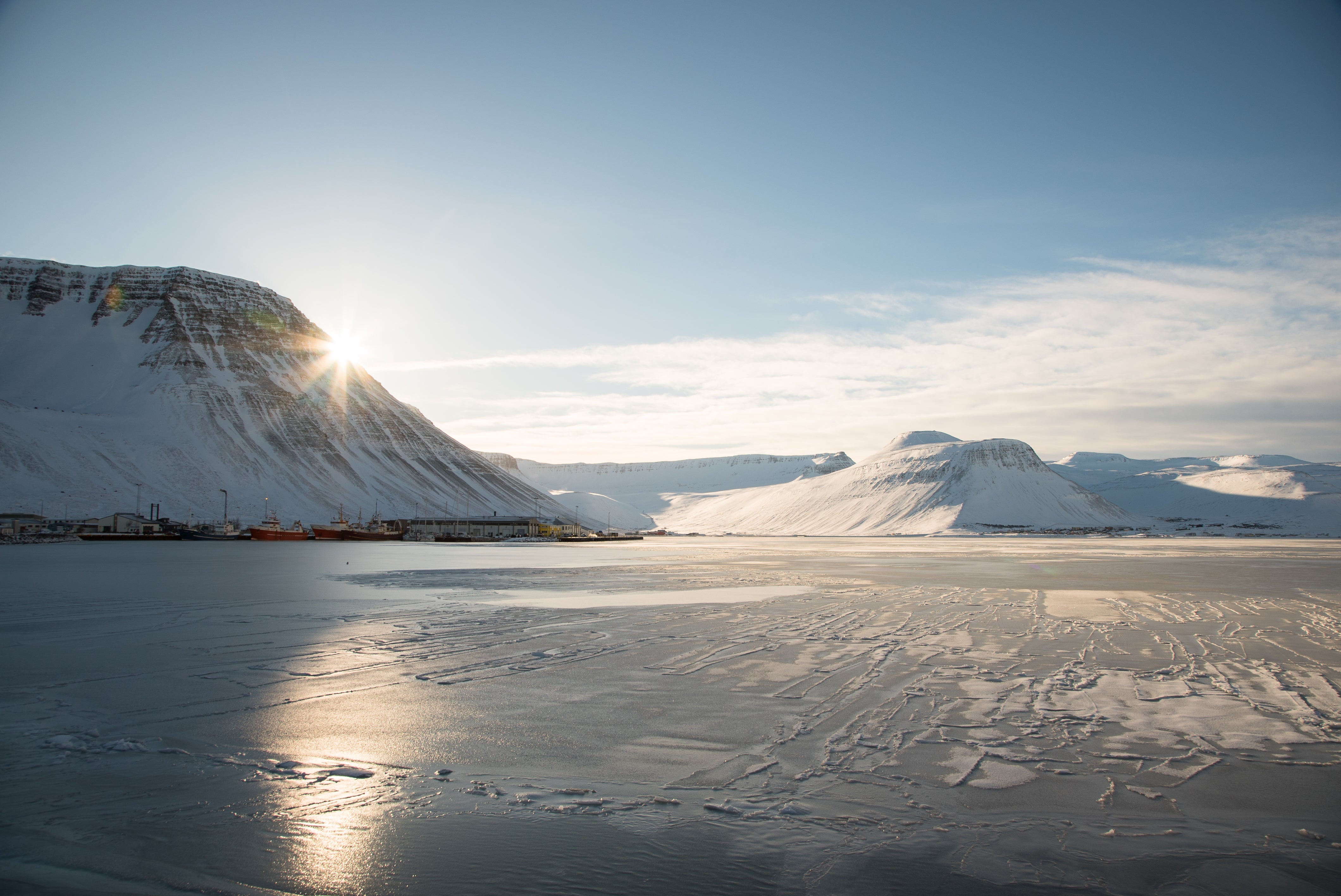 Village towns are dwarfed by ghostly mountains