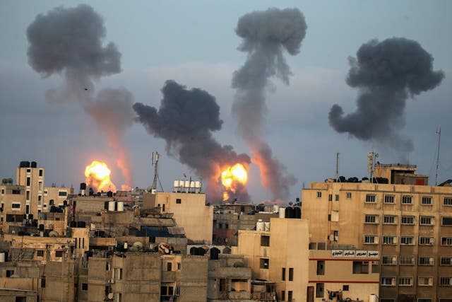 Flames and smoke rise during Israeli air strikes in Gaza