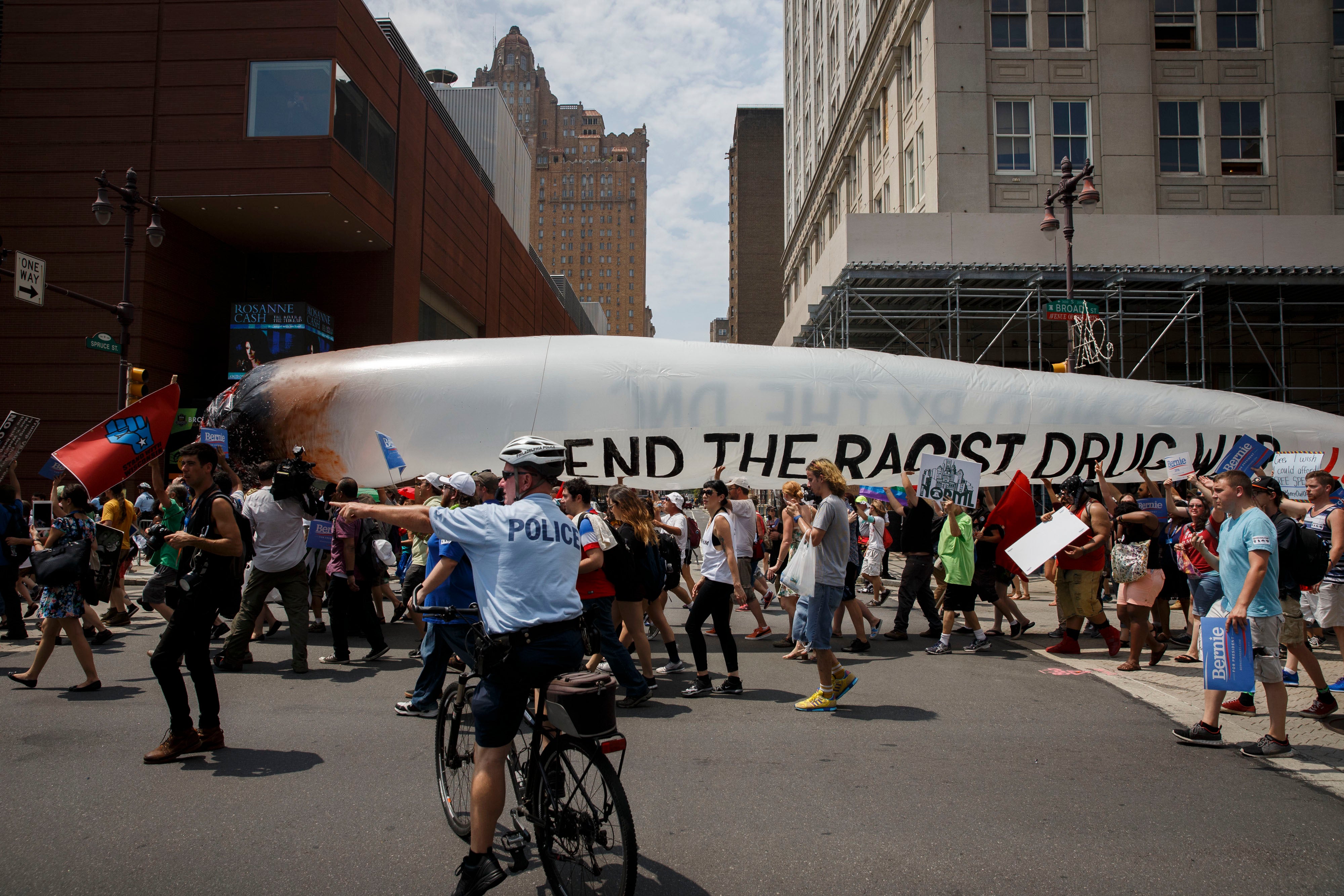 People march with a 51-foot-long marijuana joint protesting the "racist drug war" and holding signs in support of former Democratic presidential candidate Bernie Sanders during a protest at the 2016 Democratic National Convention, July 25, 2016 in Philadelphia, Pennsylvania.