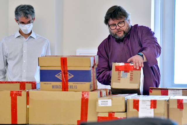 <p>File image: Election auditors Harri Hursti, right, and Mark Lindeman, catalog ballot boxes in Pembroke, New Hampshire, during a forensic audit of the 2020 New Hampshire legislative election. Auditors have found no evidence of fraud or political bias in the controversial New Hampshire election that has drawn the interest of Donald Trump</p>