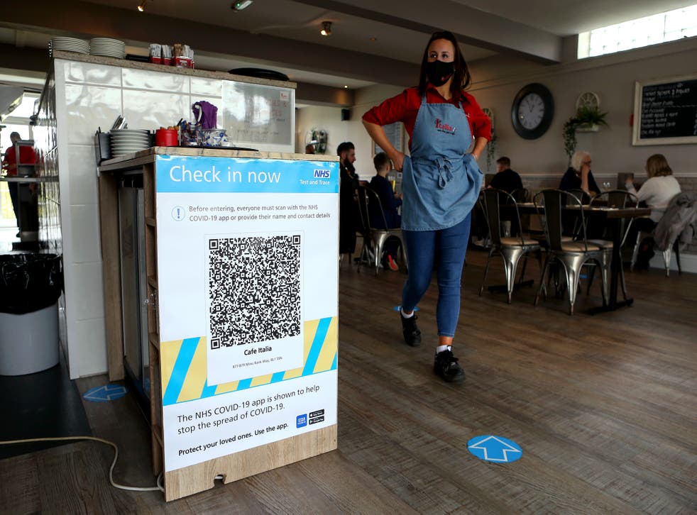 <p>An NHS track and trace QR code is seen on a wall inside Cafe Italia as indoor hospitality returns, however, fears of new variants are mounting</p>
