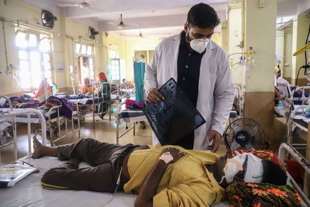 <p>A doctor assists a Covid-19 coronavirus patient with Black Fungus, a deadly and rare fungal infection</p>