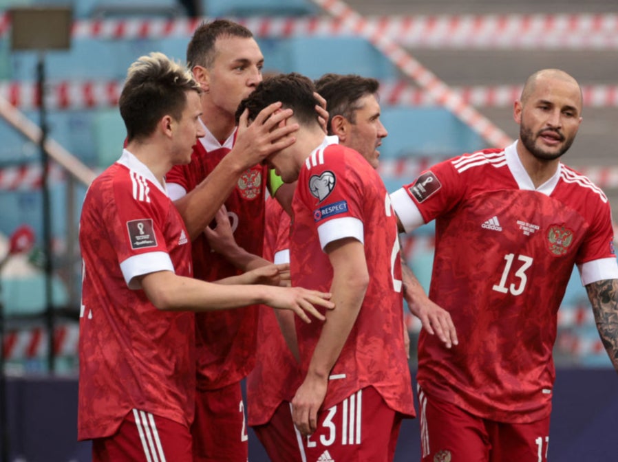 Russia's forward Artem Dzyuba celebrates with teammates