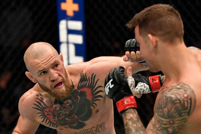 <p>Conor McGregor was knocked out by Dustin Poirier (right) in January</p>