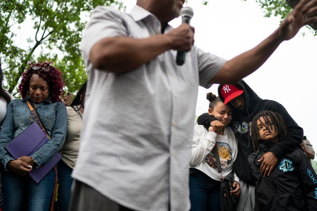 <p>Pastor Brian Herron prays for the families of Trinity Ottoson-Smith and Ladavionne Garrett Jr. during a prayer vigil at North Memorial hospital after three children were shot in the last week in Minneapolis, Tuesday, May 18, 2021. </p>