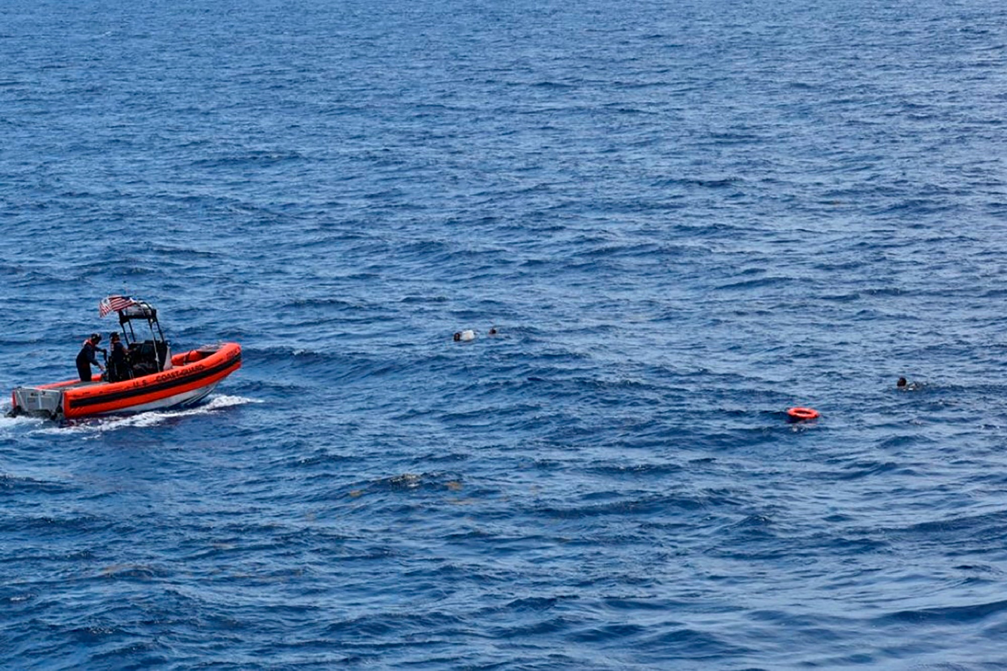 A Coast Guard crew rescues eight people from the water approximately 16 miles south of Key West