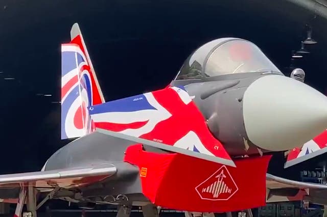 <p>The Royal Air Force unveiled a new paint job for the Typhoon Eurofighter display jet - in new red, white and blue of the British flag </p>