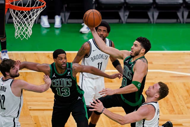 Boston Celtics forward Jayson Tatum drives to the basket past the Brooklyn Nets’ Blake Griffin