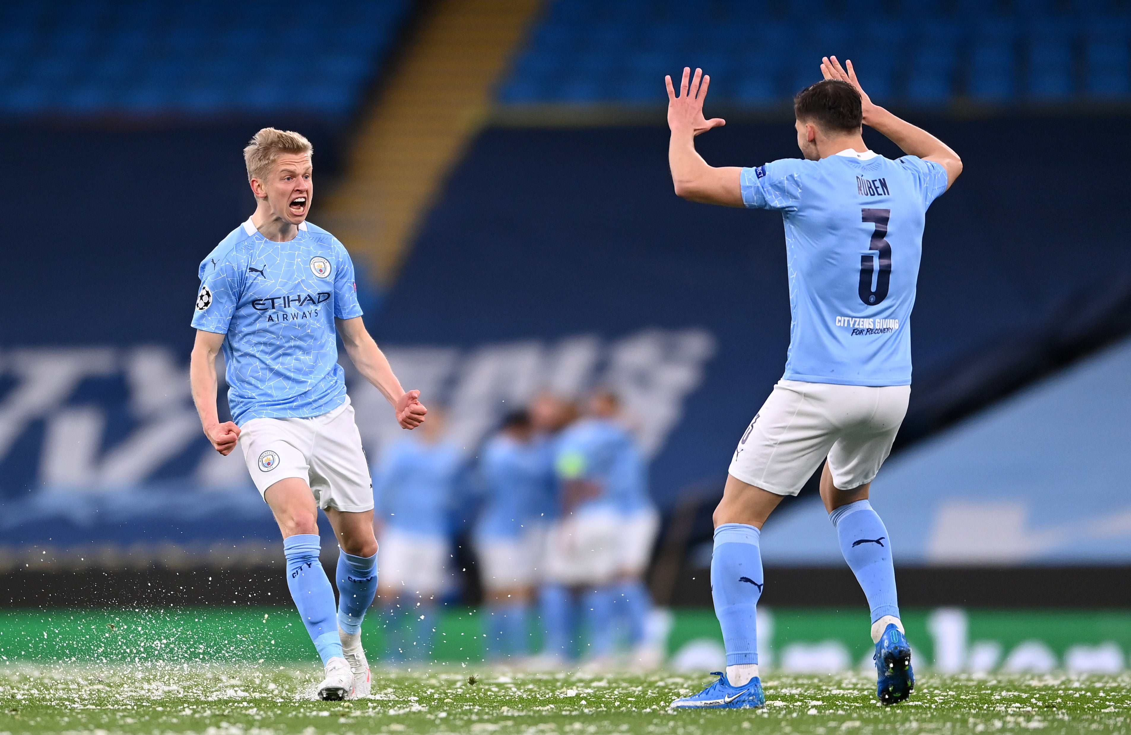 Zinchenko celebrates with Ruben Dias after Riyad Mahrez scores against PSG