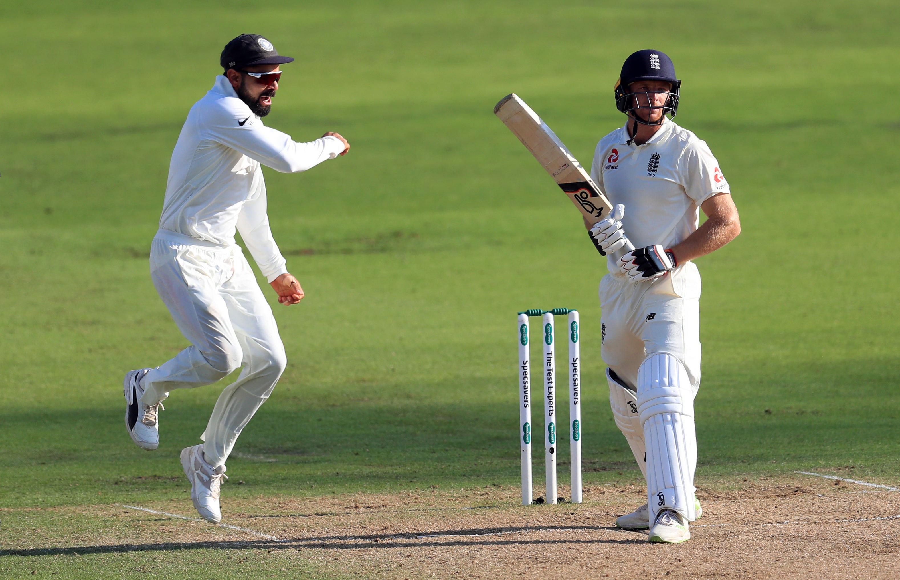 India’s Virat Kohli, left, celebrates the wicket of England’s Jos Buttler