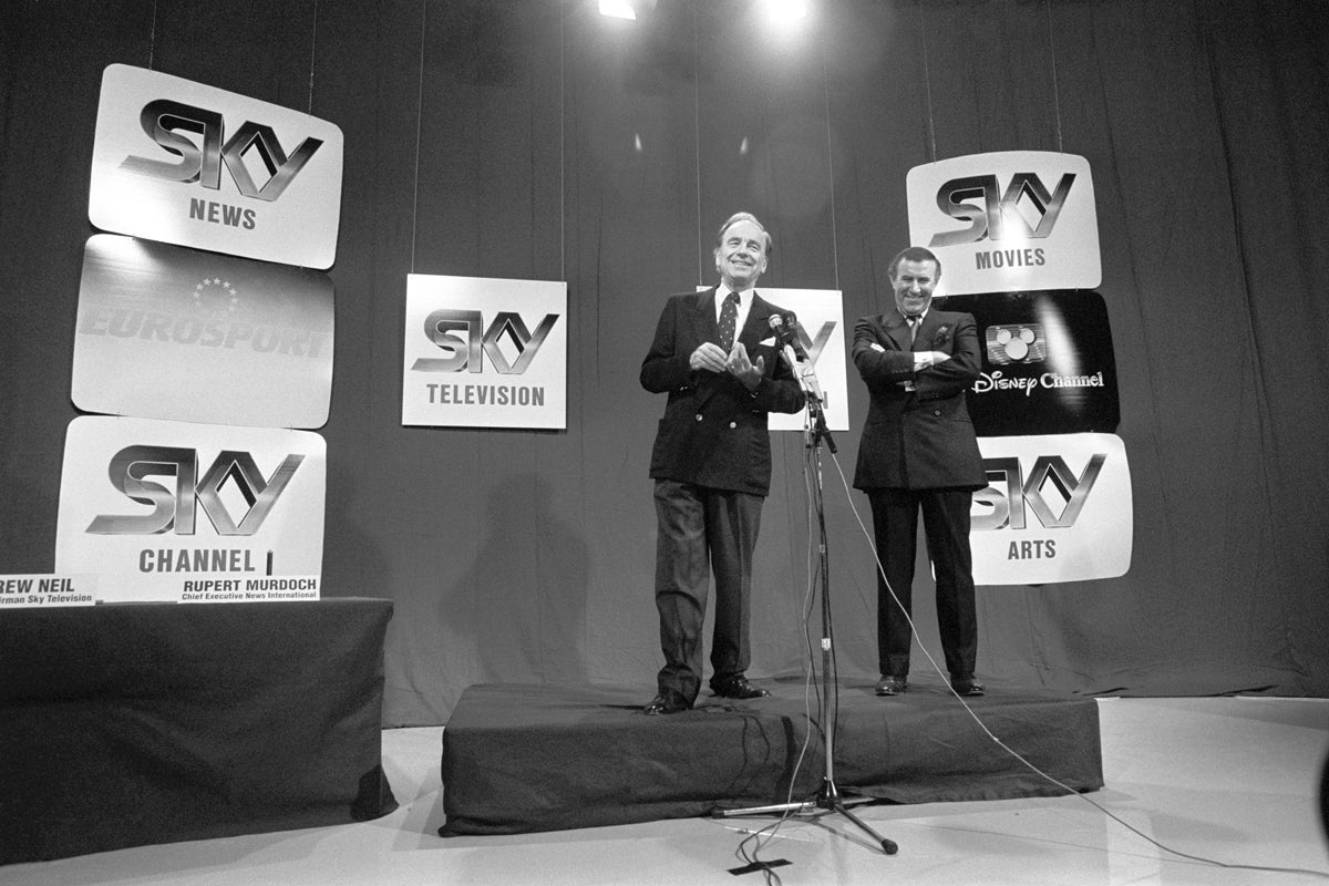 As executive chair of Sky Television, Neil stands alongside Rupert Murdoch, News International chief executive, at the launch of Britain’s first satellite TV network, on 5 February 1989