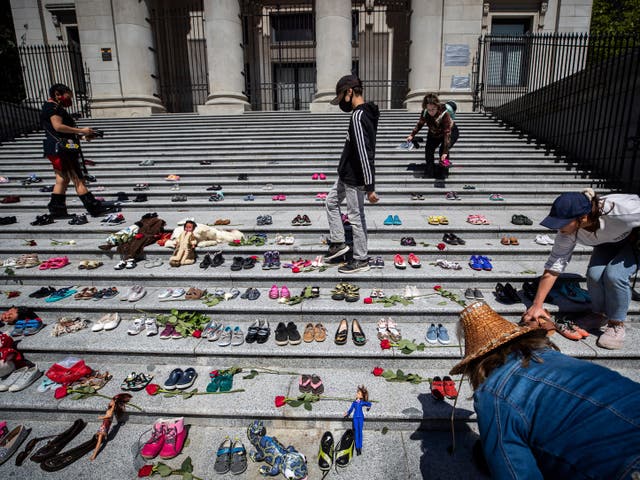 <p>More than 200 pairs of children’s shoes have been placed on the steps of the Vancouver Art Gallery to pay tribute to those buried at the school site</p>