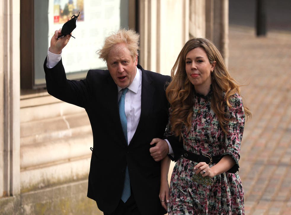 <p>Britain’s Prime Minister Boris Johnson and partner Carrie Symonds arrive at Methodist Hall in central London to cast their votes in local elections on 6 May, 2021. The PM and Ms Symonds have reportedly tied the knot in a pared-back ceremony.</p>