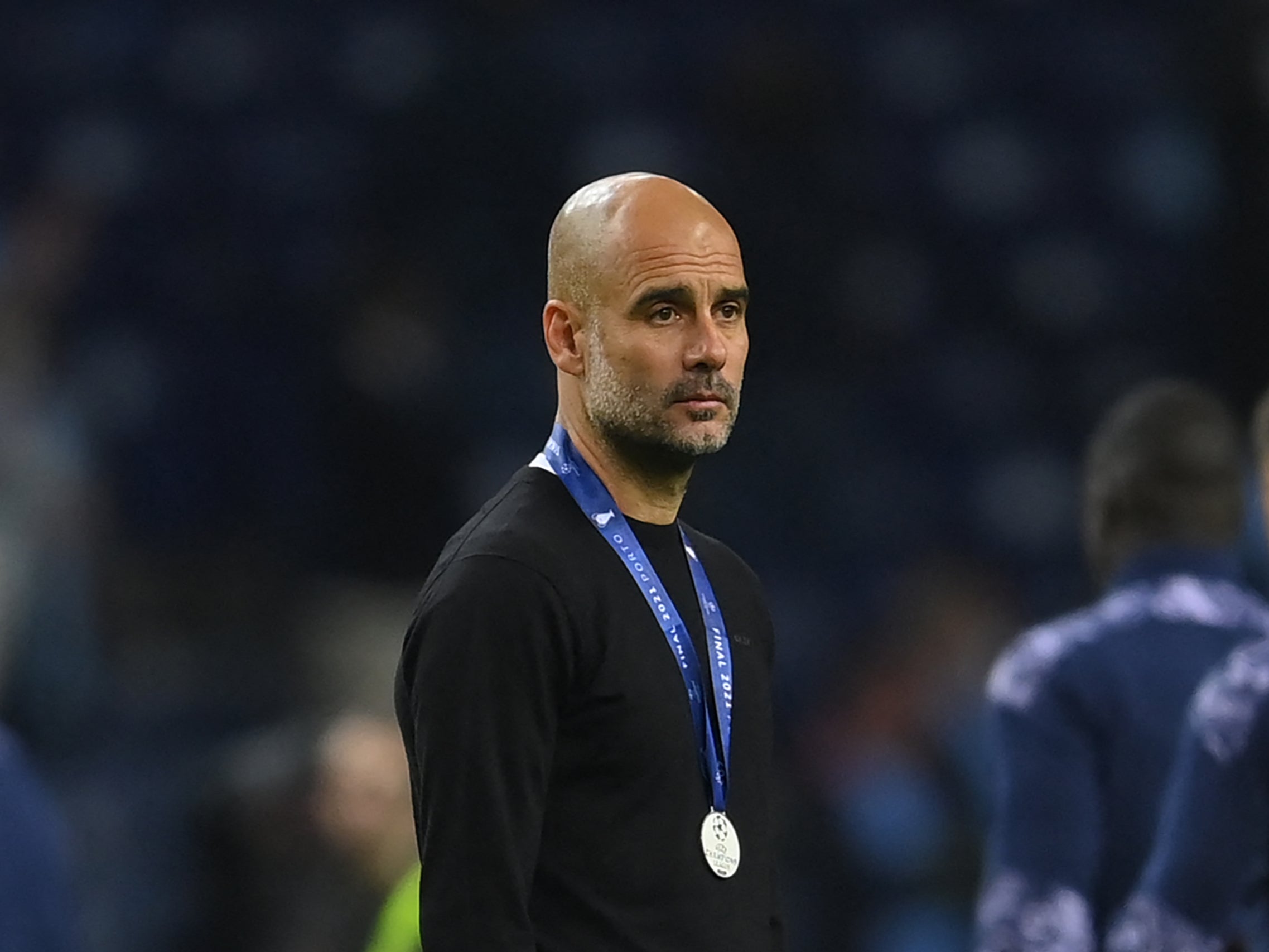 Guardiola looks on dejected after defeat