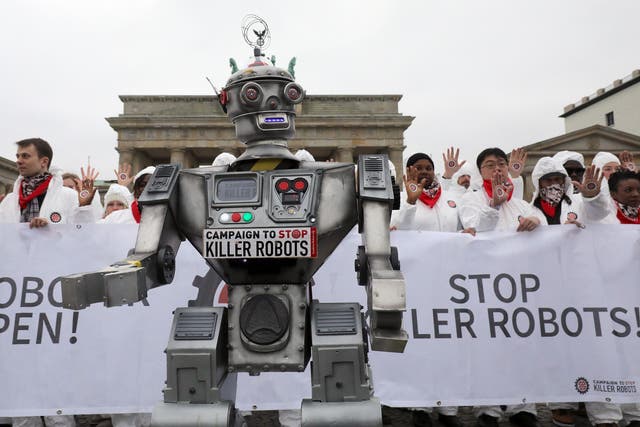 <p>People take part in a demonstration as part of the campaign ‘Stop Killer Robots’ organised by German NGO ‘Facing Finance’ to ban what they call killer robots</p>