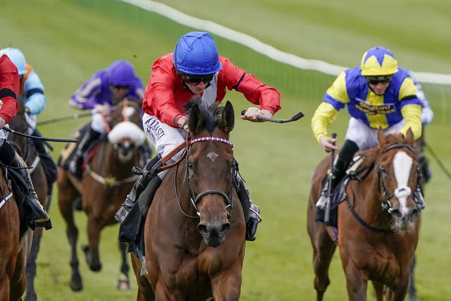 Sacred (centre) on her way to winning the Nell Gwyn Stakes