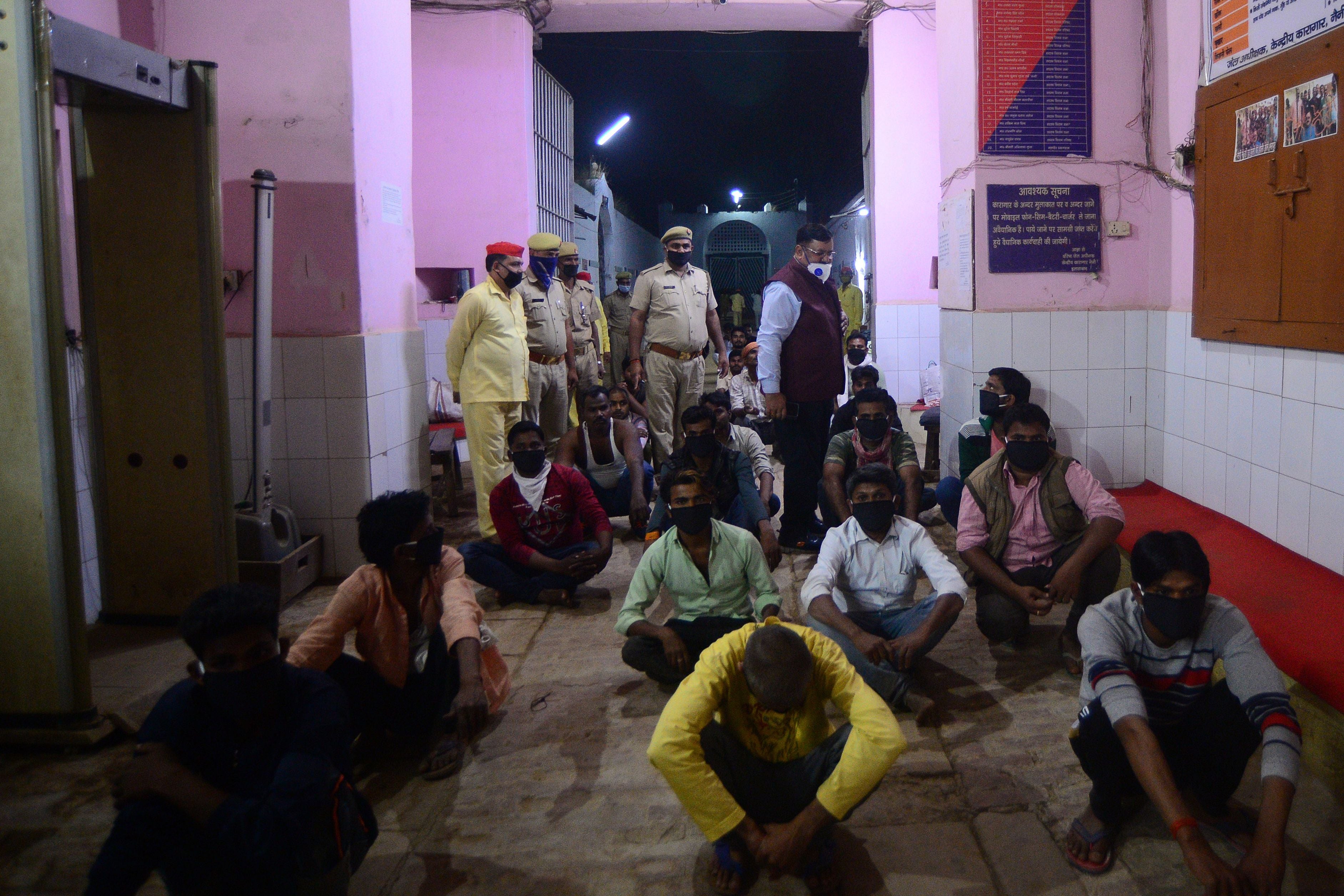 Prisoners wait to be released on parole from Naini central jail in Allahabad
