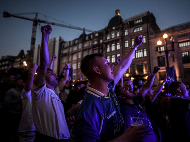 <p>Chelsea supporters react as they watch the UEFA Champions League final football match between Manchester City and Chelsea in a fan zone in downtown Porto</p>
