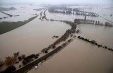 Flood recedes in New Zealand, leaving debris, broken bridge