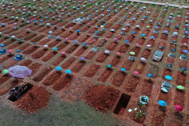 <p>File image: In this 20 March, 2021, photo, a worker digs a grave in the San Juan Bautista cemetery in Iquitos, Peru. On 31 May, 2021, Peru announced a sharp increase in its Covid-19 death toll, saying there have been more than 180,000 fatalities since the pandemic hit the country early last year</p>
