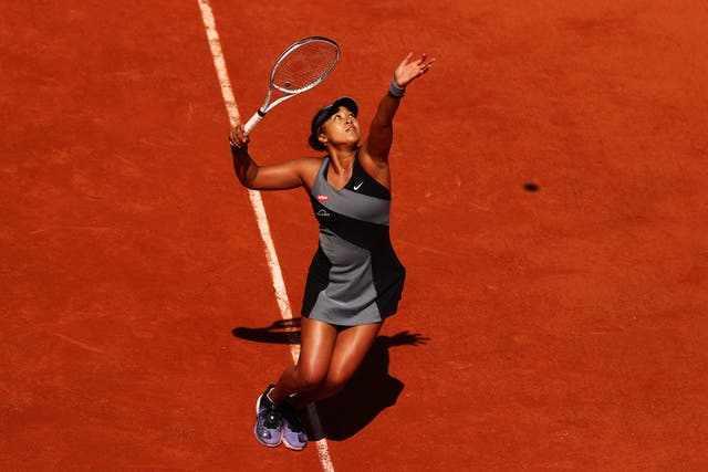 <p>Naomi Osaka serves in her first round match against Patricia Maria Tig at the French Open</p>
