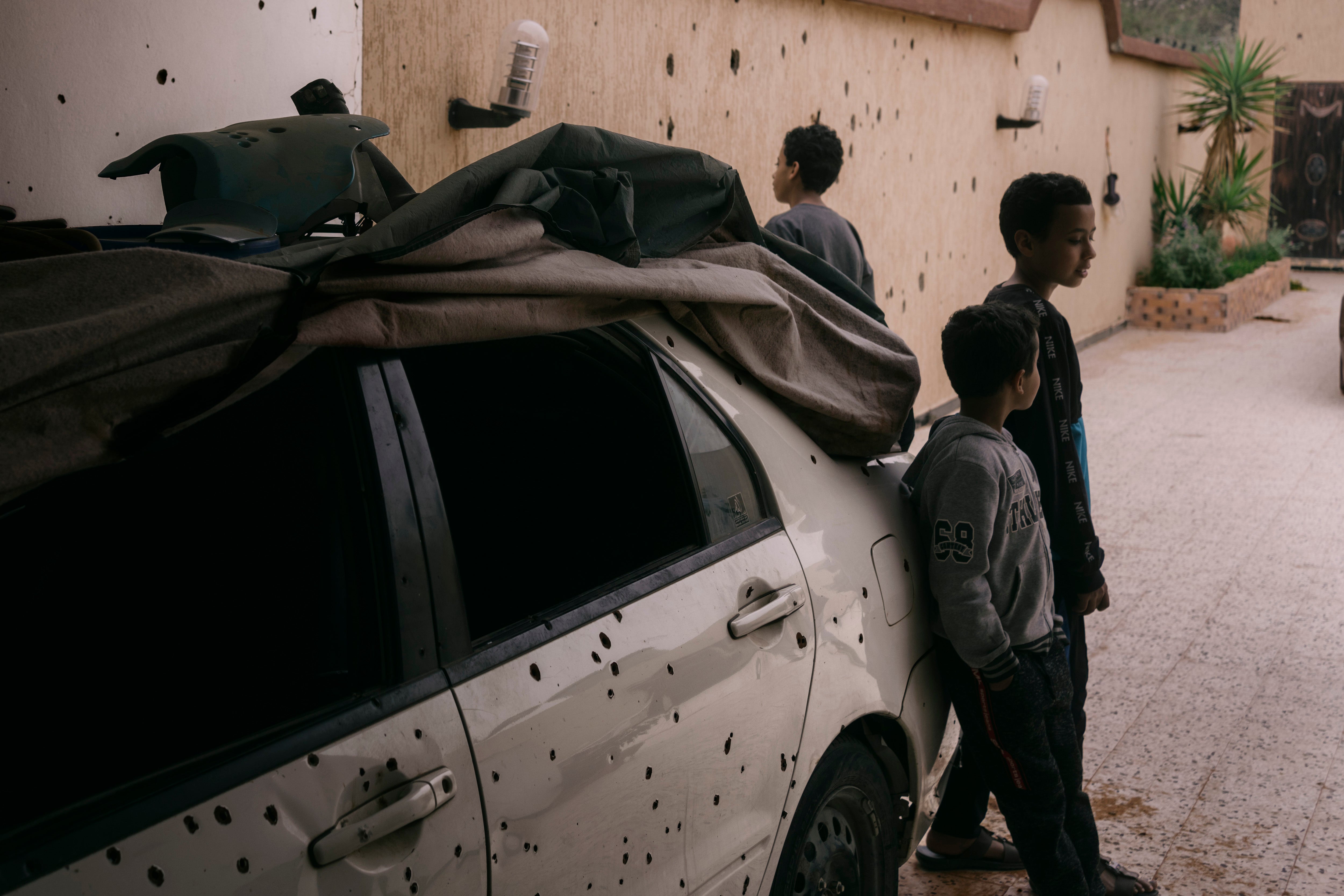 Abdul Rahman al-Ghobaily’s children pictured outside their home. Al-Ghobaily was injured twice by booby traps left behind on the family’s property