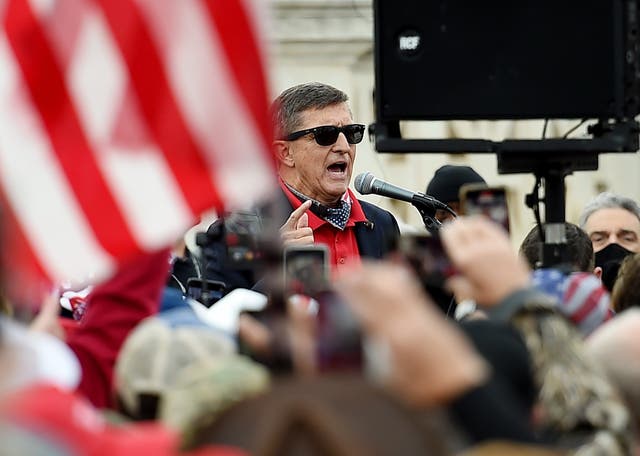 <p>Former US National Security Advisor Michael Flynn speaks to supporters of US President Donald Trump during the Million MAGA March to protest the outcome of the 2020 presidential election in front of the US Supreme Court on December 12, 2020 in Washington, DC</p>