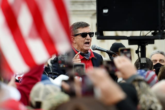 <p>Former US National Security Advisor Michael Flynn speaks to supporters of US President Donald Trump during the Million MAGA March to protest the outcome of the 2020 presidential election in front of the US Supreme Court on December 12, 2020 in Washington, DC</p>