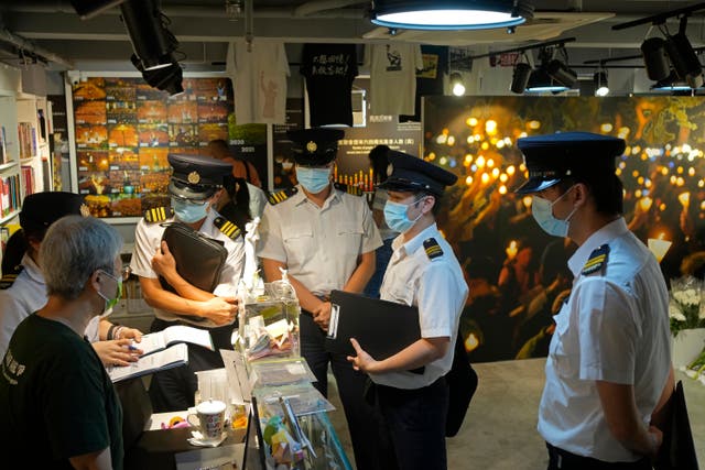 <p>Officers from the Food and Environmental Hygiene Department conduct an investigation at the ‘June 4 Memorial Museum’ in Hong Kong on 1 June for allegedly not having relevant licenses required for public exhibition</p>