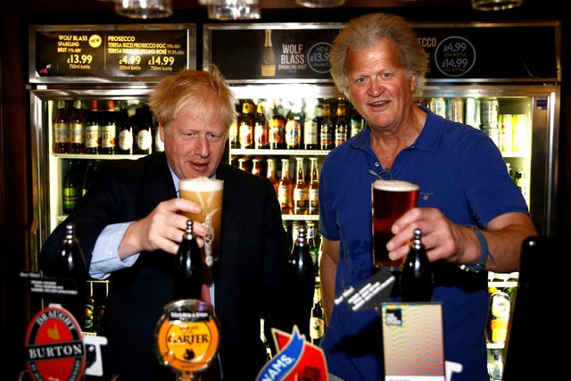 <p>Pulling another one: Boris Johnson meets pub group chairman Tim Martin at Wetherspoon's Metropolitan Bar in London</p>