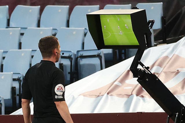 <p>Referee Peter Bankes checks the VAR monitor as Aston Villa take on Manchester City</p>