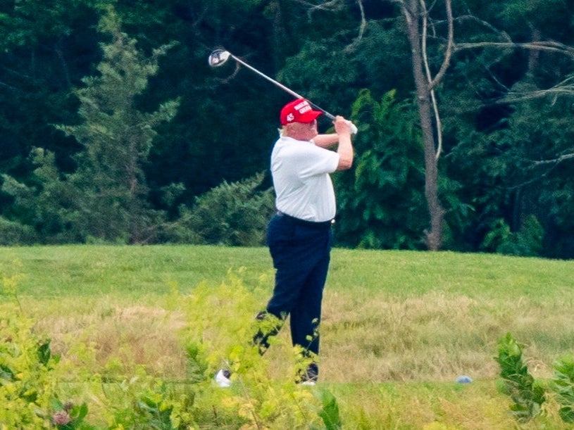 Former US president Donald Trump golfs at his course in Sterling, Virginia