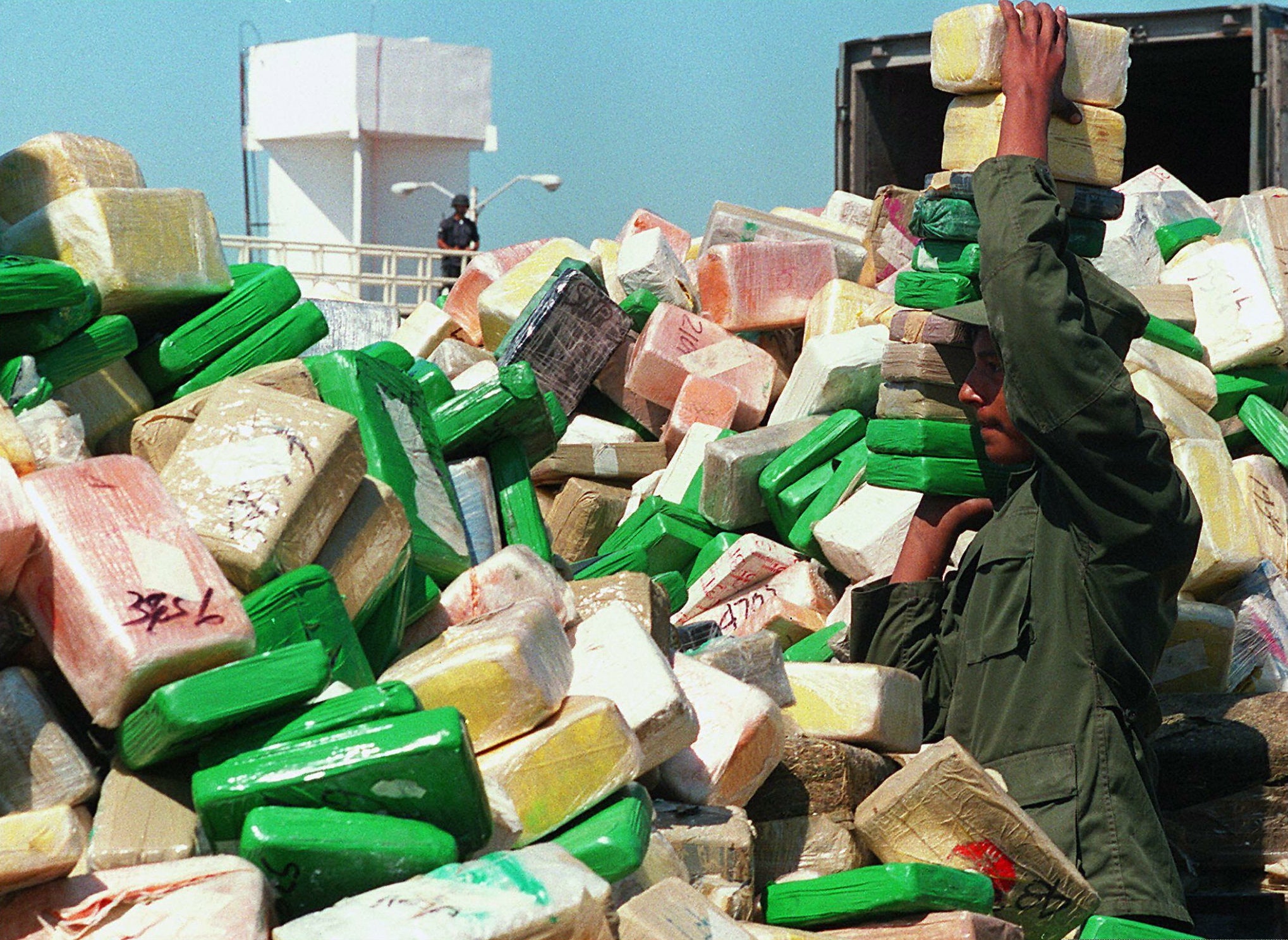 Soldiers pile up two-kilo bricks of confiscated cocaine to be burned by the Mexican drug enforcement agency