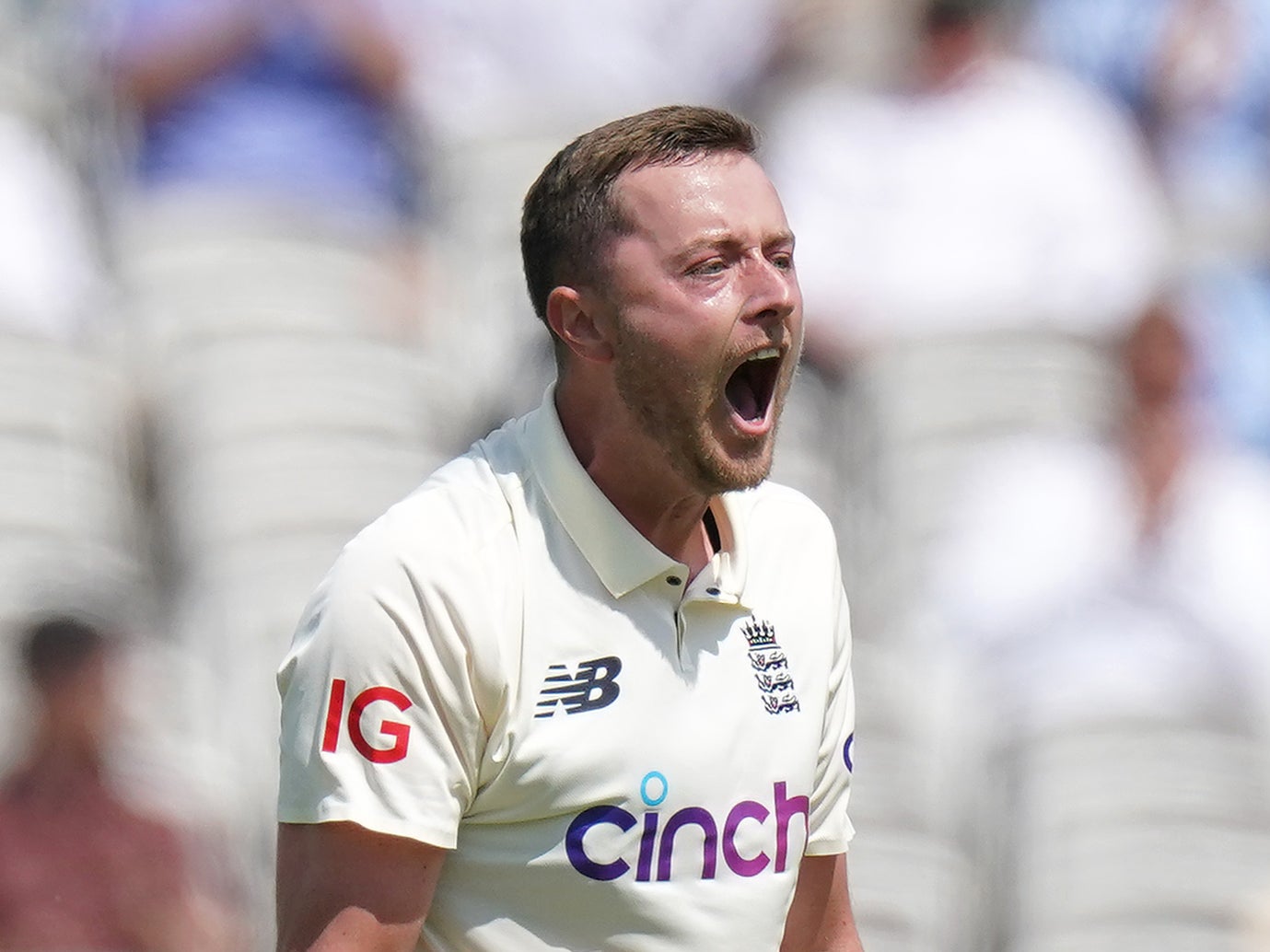 England’s Ollie Robinson celebrates taking the wicket of New Zealand’s Tom Latham