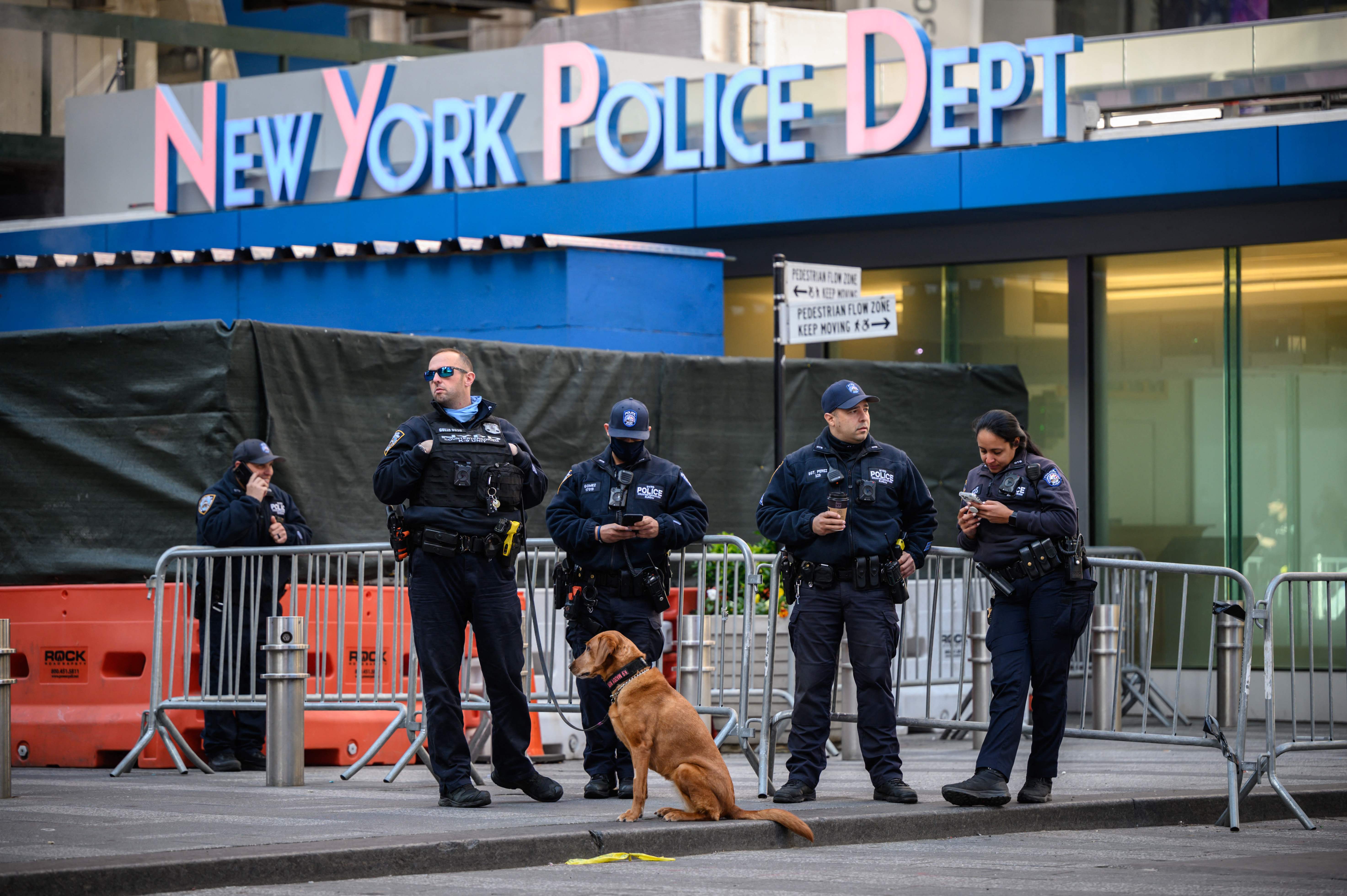 Police officers standing outside the Times Square police station.